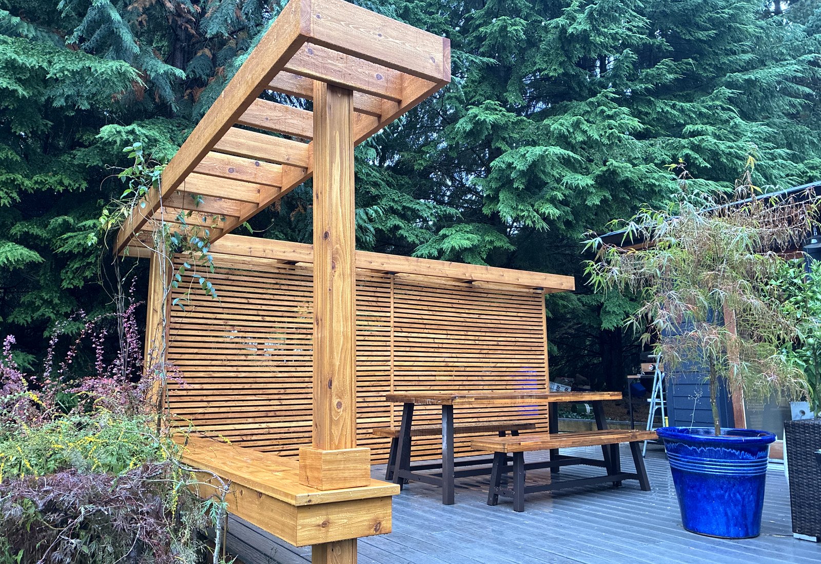 Restored outdoor wood pergola and deck detail