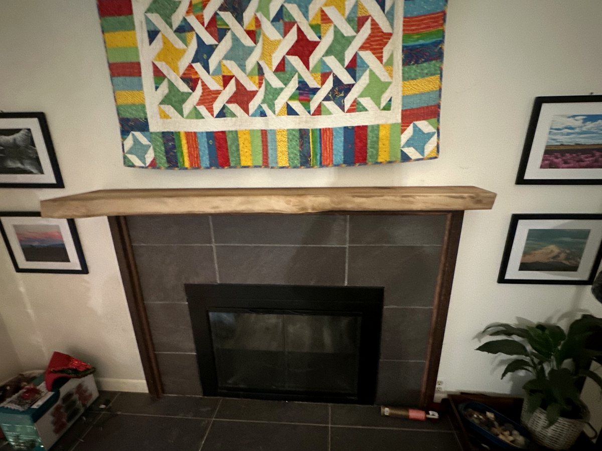 Restored wood mantel above fireplace